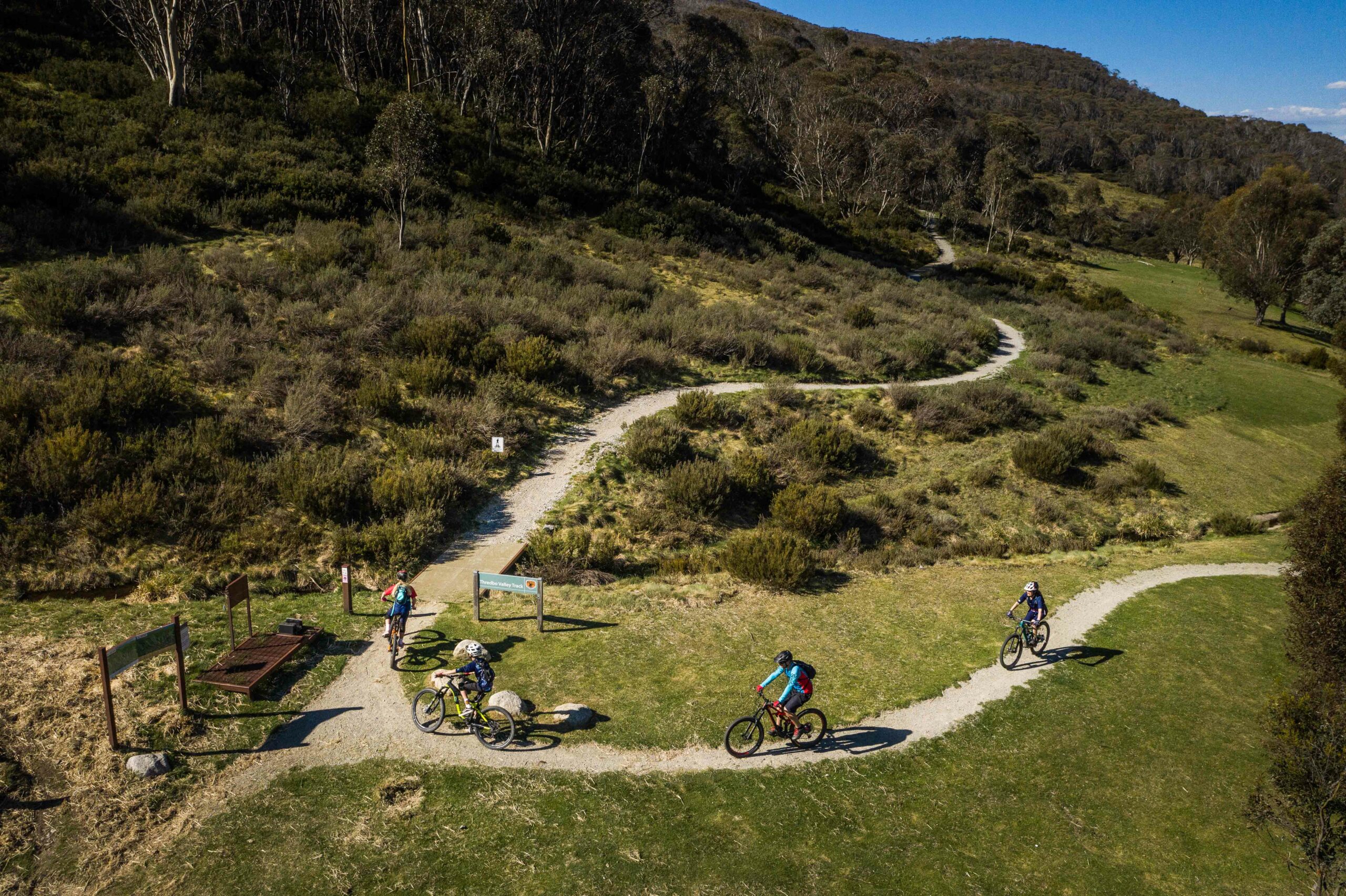 A Group of Riders Take on the Turns of the Thredbo Valley Track