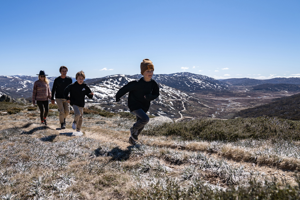 A family of four running in the Kosciuszko National Park